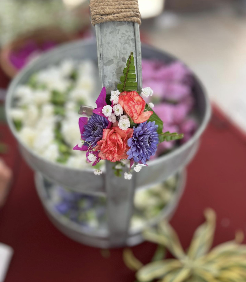 Flowers in a tin part of an cultural craft at the Lahaina Cannery Mall