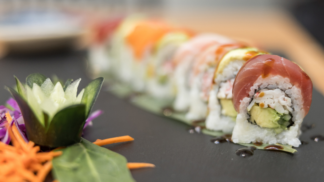 Lahaina Sushi Ko - California roll with avocado topped with ahi, avocado, shrimp, salmon with wasabi and cucumber and carrots on the side