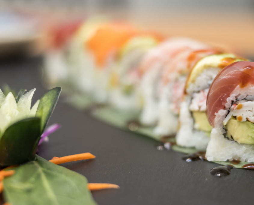 Lahaina Sushi Ko - California roll with avocado topped with ahi, avocado, shrimp, salmon with wasabi and cucumber and carrots on the side