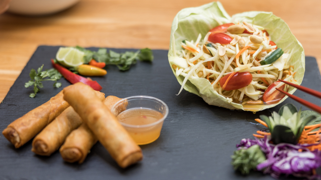 Lahaina Thai Ono - Spring Rolls with dipping sauce and bean sprouts with peppers on the side