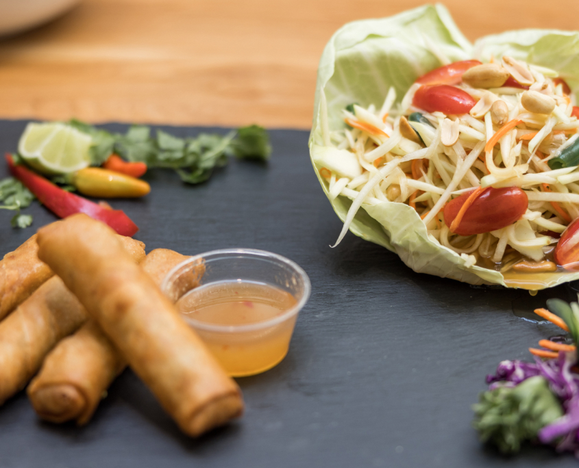 Lahaina Thai Ono - Spring Rolls with dipping sauce and bean sprouts with peppers on the side